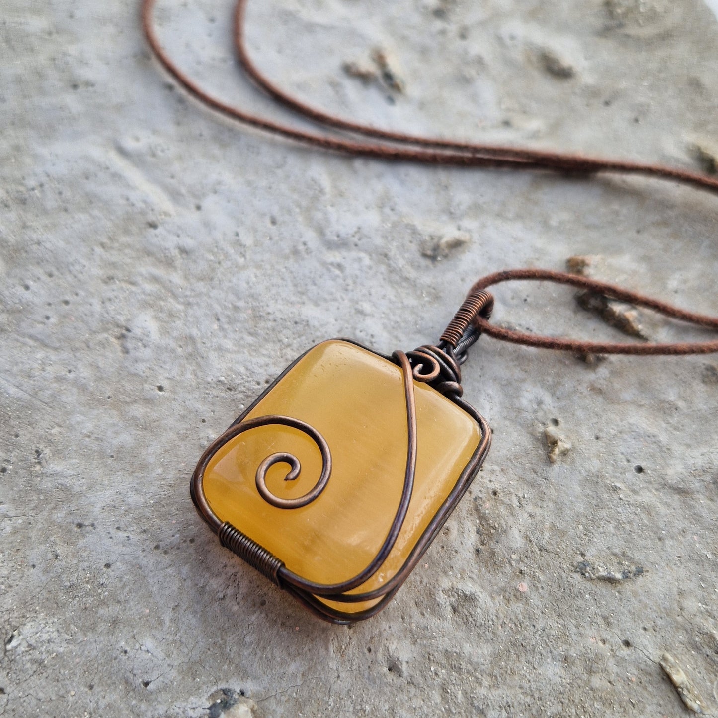 Crystal pendant on brown wax cord