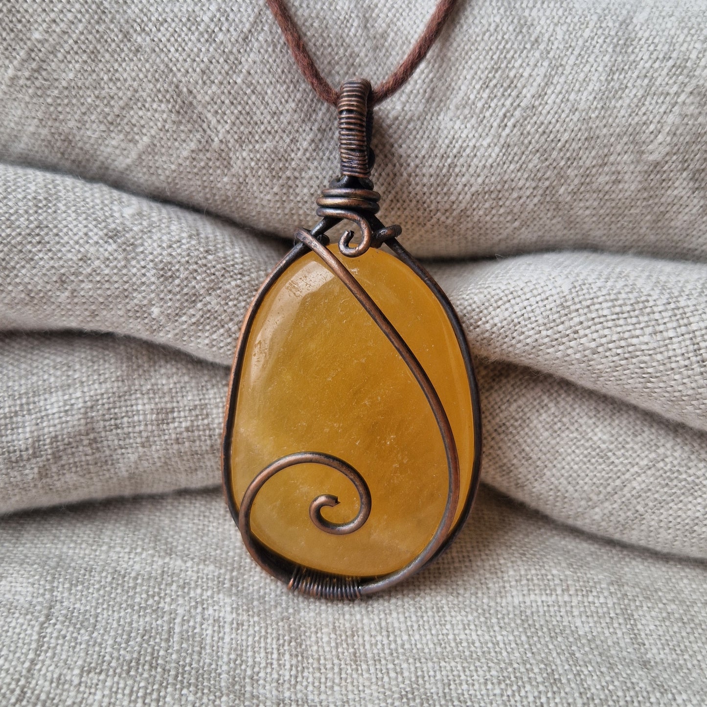 Memorial orange calcite crystal pendant