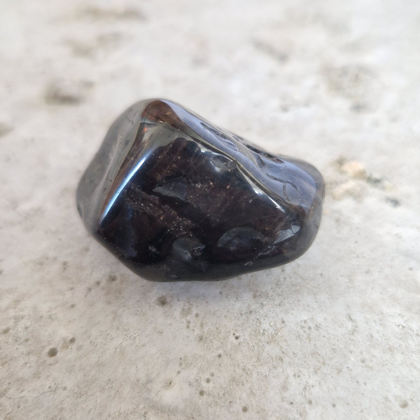Black onyx palm crystal for emotional healing from losing a pet