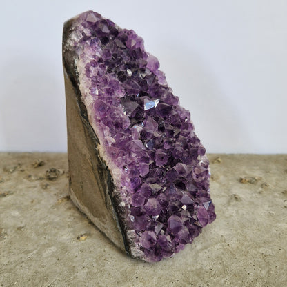 A beautiful amethyst geode imprinted with the life essence of a cherished pet