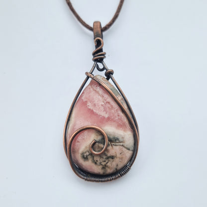 Wire wrapped rhodochrosite crystal pendant