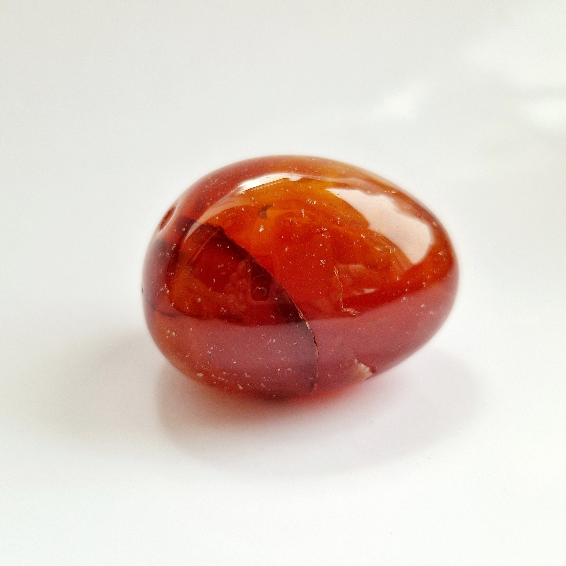 Carnelian palm crystal providing comfort in times of grief.