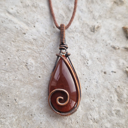 Copper wire wrapped teardrop carnelian crystal pendant for emotional support