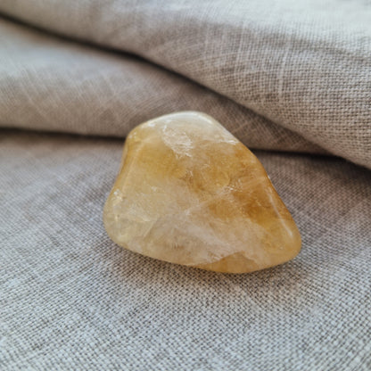 Citrine palm crystal for healing from grief