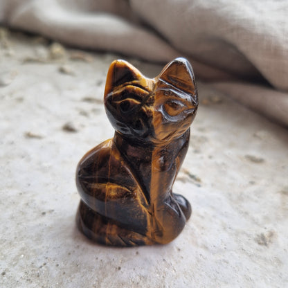 A tigers eye crystal cat that has been imprinted with the unique energy pattern of a cherished pet.