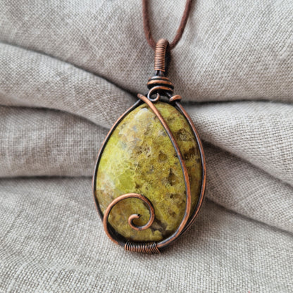 Close up of a green opal memorial crystal