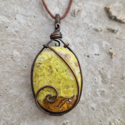A close-up of a Green Opal pendant