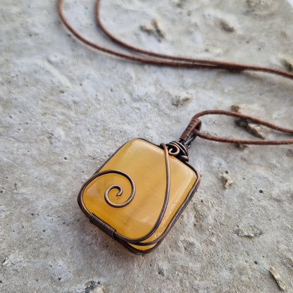 Crystal pendant on brown wax cord