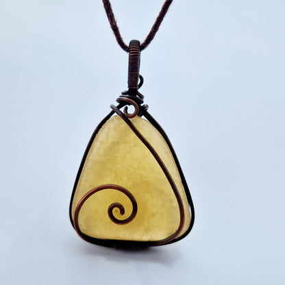 Frequency imprinted orange calcite crystal for helping with loss