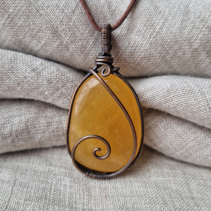 Memorial orange calcite crystal pendant