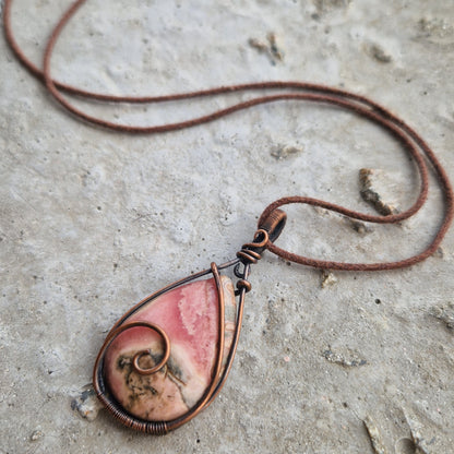 Frequency imprinted rhodochrosite crystal for grief support