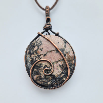 Rhodonite energy infused healing stone pendant