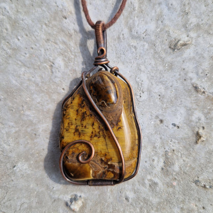 Energy infused tigers eye crystal pendant for healing from the loss of a pet